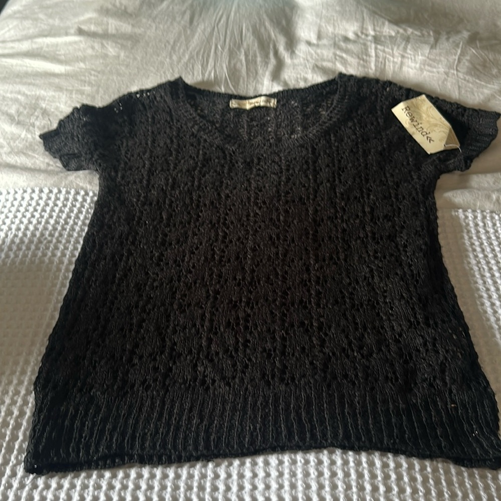 Black short sleeve crocheted top. Size small.